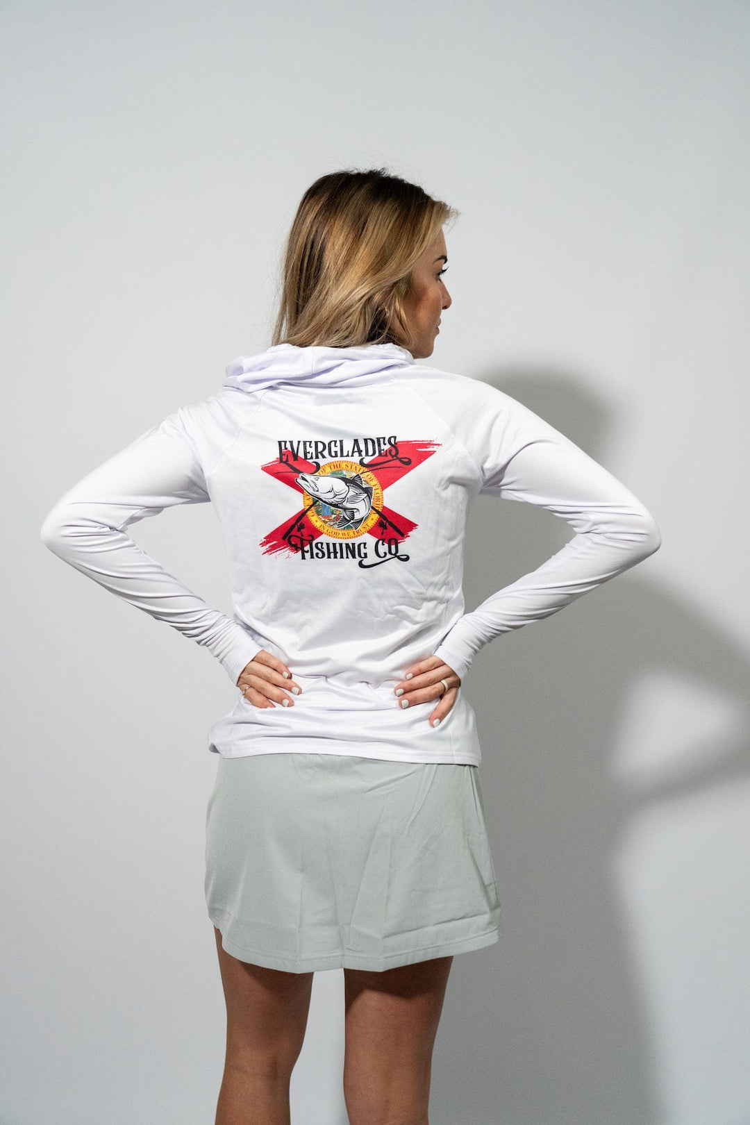 White women's performance hood shirt by Everglades Fishing Co, featuring a comfortable fit and breathable fabric for outdoor activities.