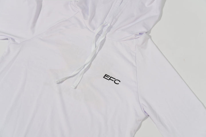White women's performance hood shirt by Everglades Fishing Co, featuring a lightweight, breathable fabric with a hood and sporty design.