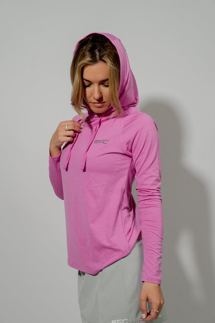 Pink women's performance hood shirt from Everglades Fishing Co, featuring lightweight fabric and a comfortable fit.