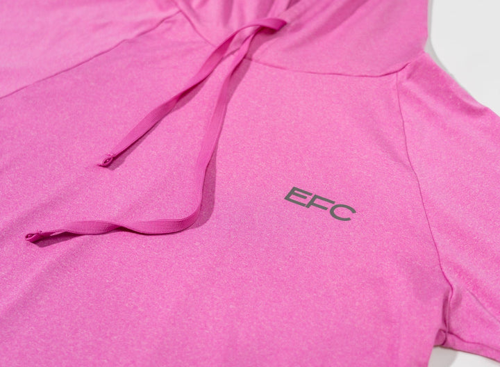 Pink women's performance hood shirt by Everglades Fishing Co, featuring lightweight fabric and a comfortable fit.