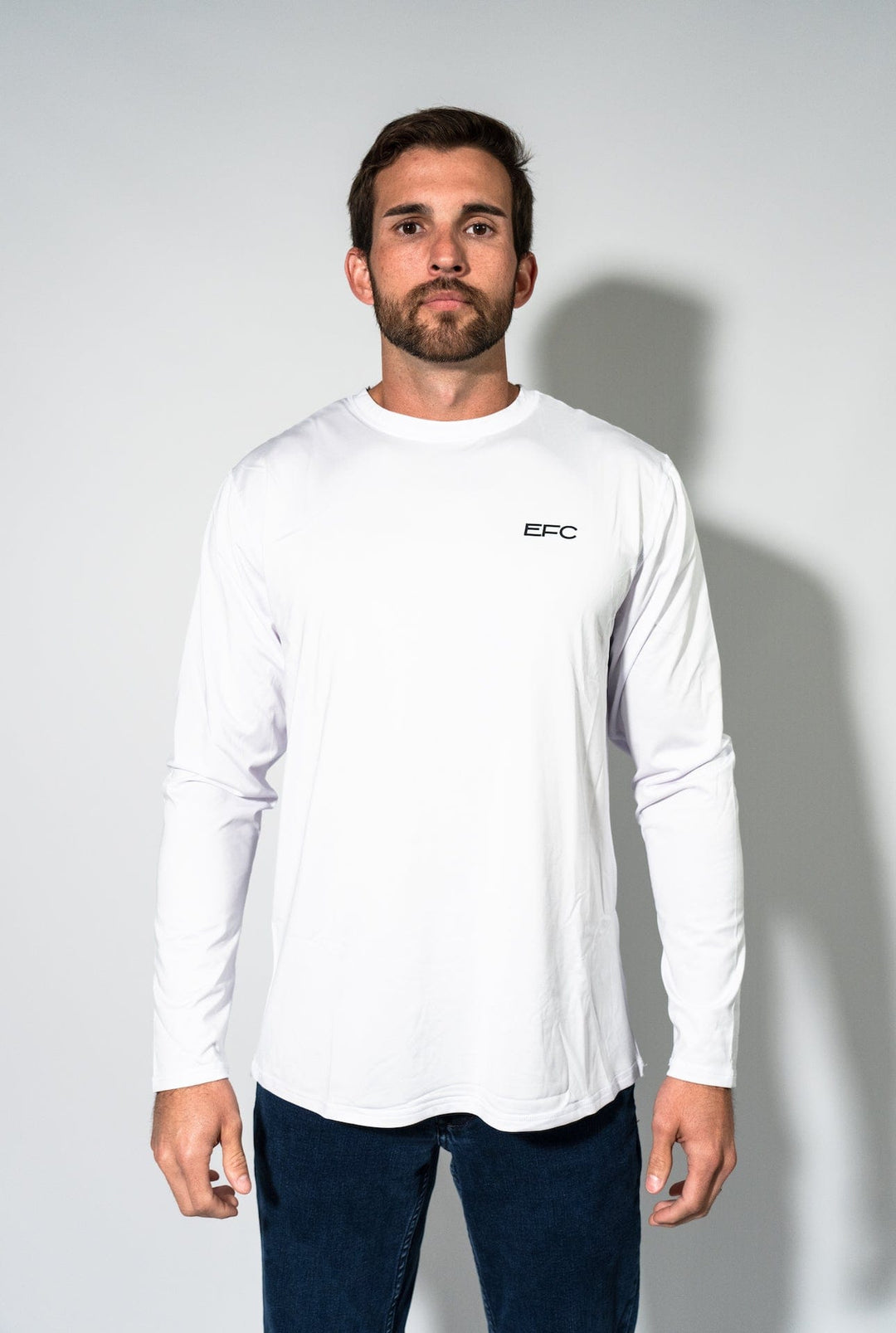Everglades Fishing Co OG White Performance Shirt displayed on a hanger, showcasing lightweight, moisture-wicking fabric and classic fit.