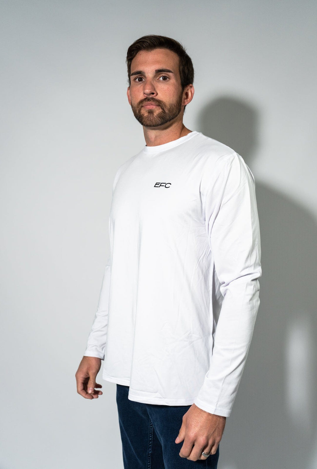 Everglades Fishing Co OG White Performance Shirt displayed on a hanger, showcasing lightweight, breathable fabric for fishing and outdoor activities.