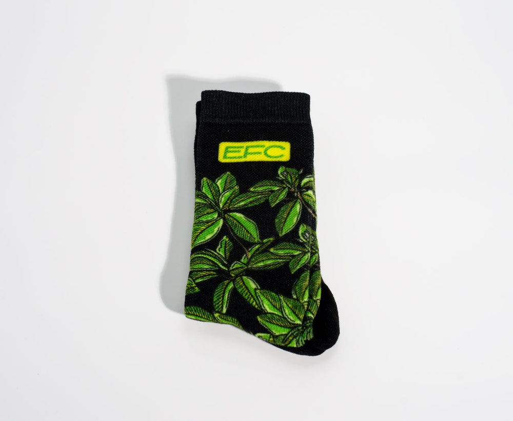 Everglades Fishing Co Mangrove Night Socks showing dark fabric with subtle green and brown patterns, comfortable crew-length socks.