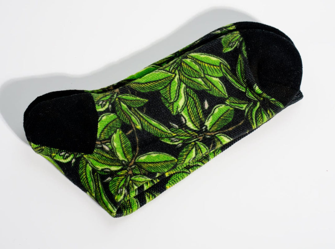 Everglades Fishing Co Mangrove Night Socks, cozy socks with green and black camouflage pattern, soft fabric, and ribbed cuffs.