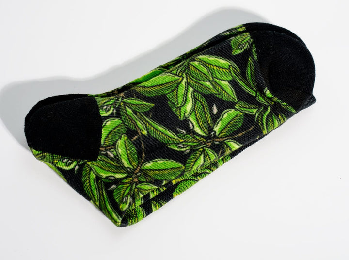 Everglades Fishing Co Mangrove Night Socks, cozy socks with green and black camouflage pattern, soft fabric, and ribbed cuffs.