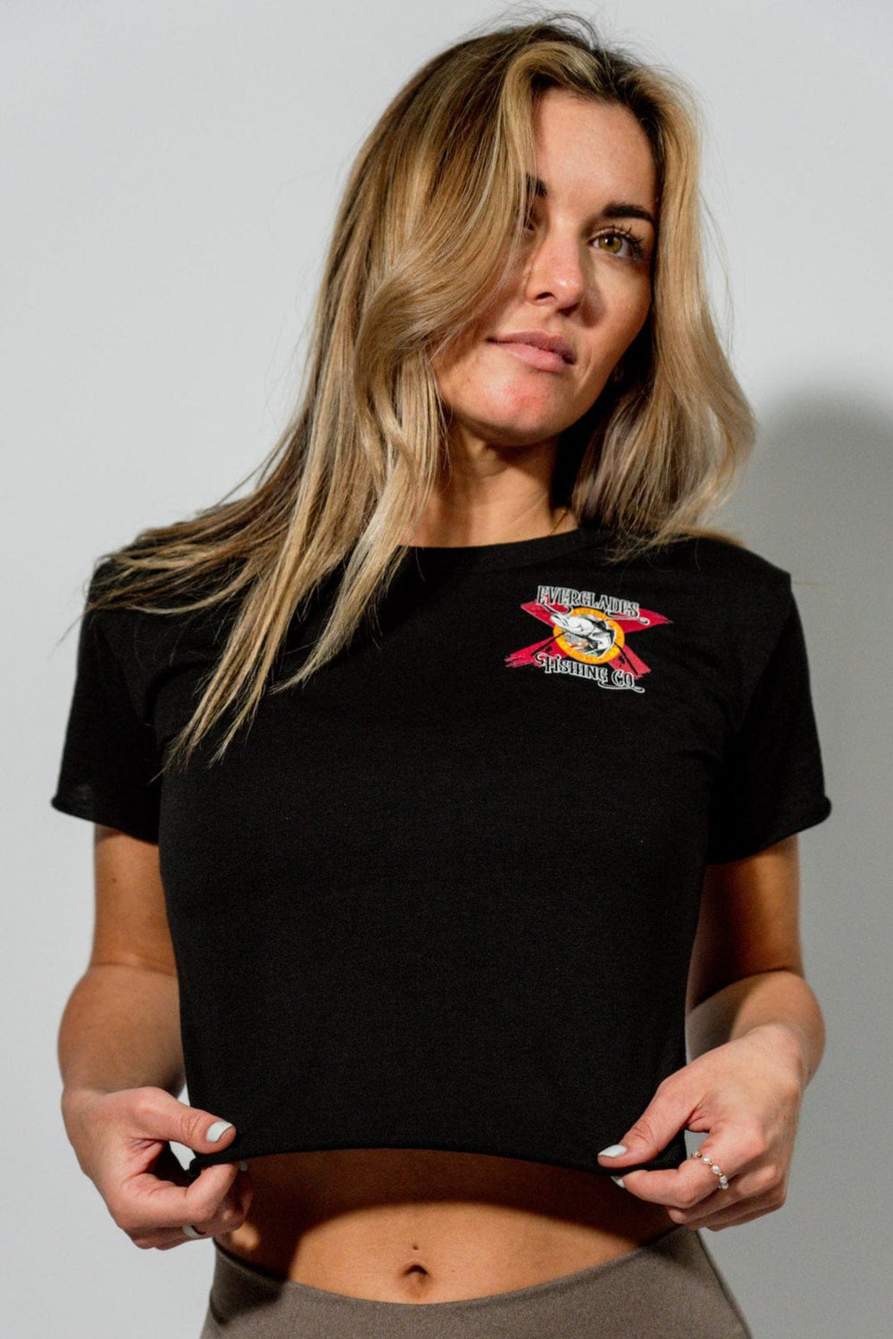Black OG Crop Top by Everglades Fishing Co, featuring a comfortable fit and stylish design, shown on a model.