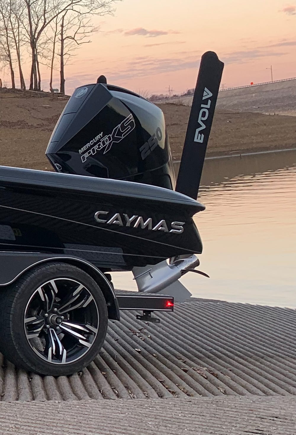 Pair of EVOLV Fishing neoprene power pole travel covers, showing black protective sleeves for fishing gear transportation.
