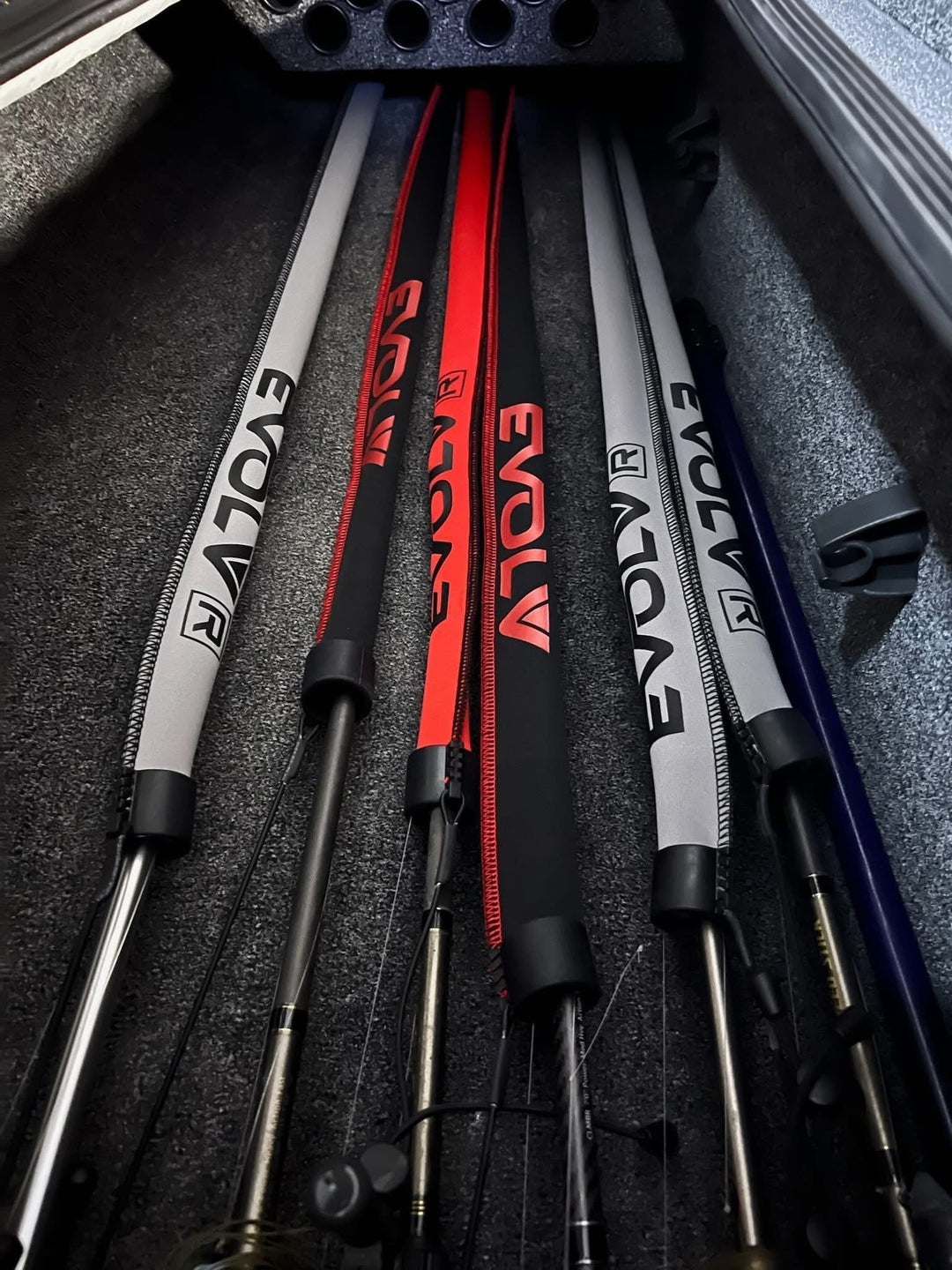 Red Tournament Edition baitcast rod sleeves by EVOLV Fishing, designed to protect and store fishing rods.