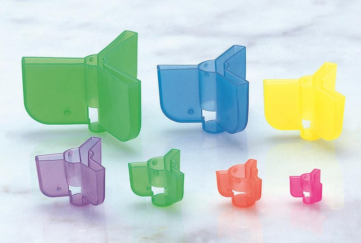 Owner Treble Hook Safety Caps for fishing accessories, shown on treble hooks to prevent injury and secure hooks during storage.