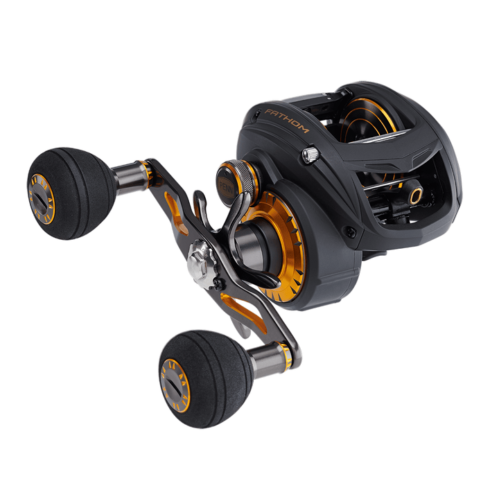 Penn Fathom Low Profile Baitcast Reel showing the reel's compact design and ergonomic handle for freshwater or saltwater fishing.
