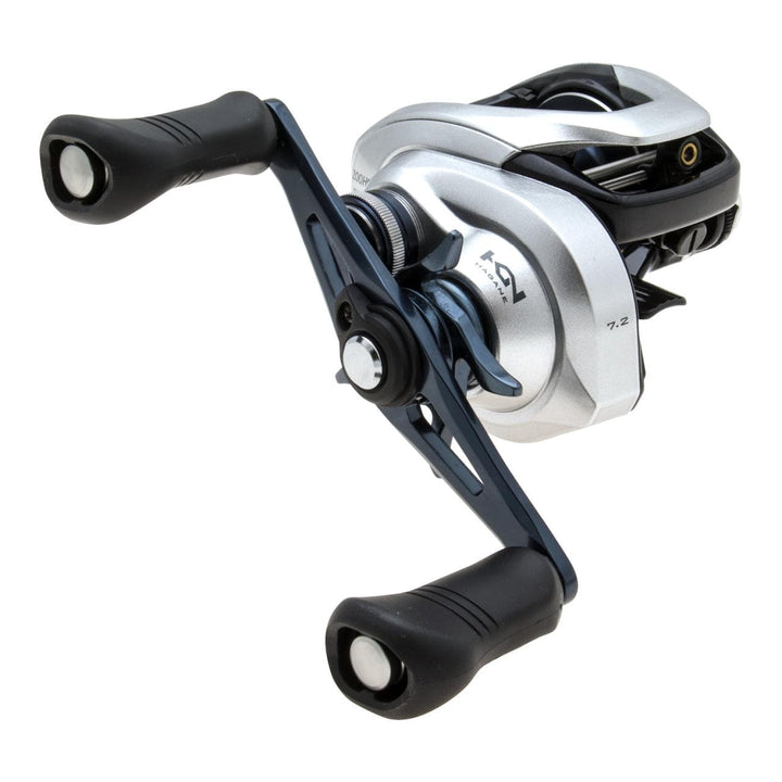 Shimano Tranx baitcasting reel with handle and spool, designed for fishing, shown in close-up with detailed features.