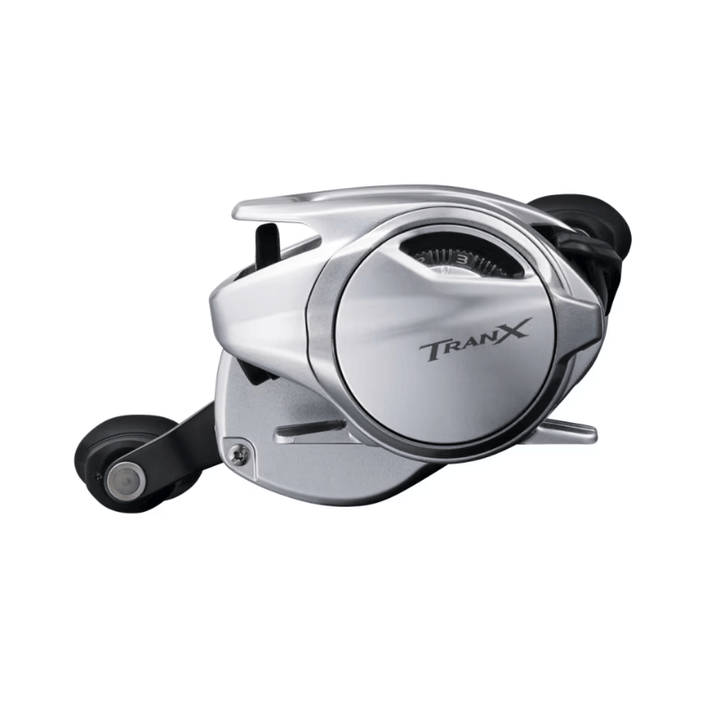 Shimano Tranx B baitcasting reel, black fishing reel with handle and spool, designed for smooth casting and durability.