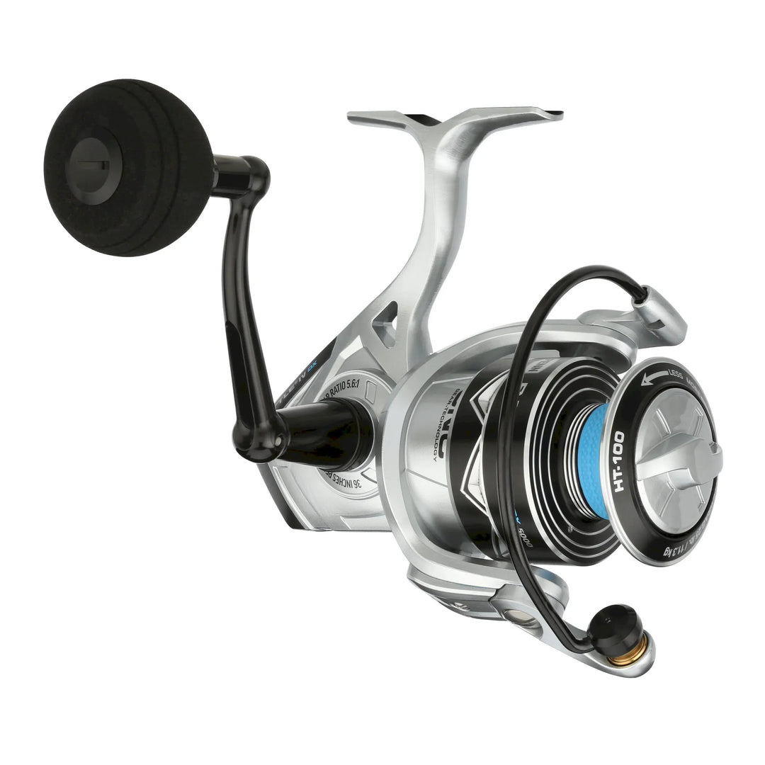 Fisherman's Headquarters Penn Battle IV DX spinning reel with black body and silver handle, mounted on a fishing rod.