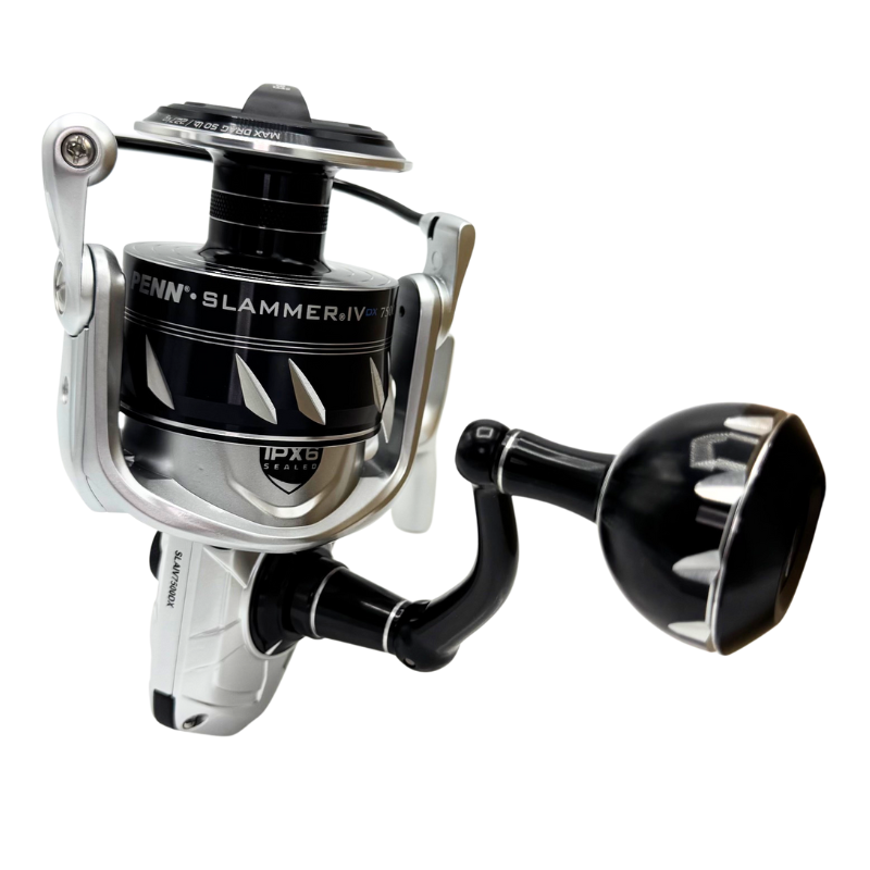 Fisherman's Headquarters Penn Slammer IV DX spinning reel, black and silver design with handle and spool, suitable for saltwater fishing.