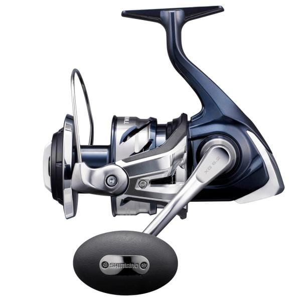 Shimano Twin Power SW spinning reel in black with silver accents, designed for saltwater fishing, mounted on a fishing rod.