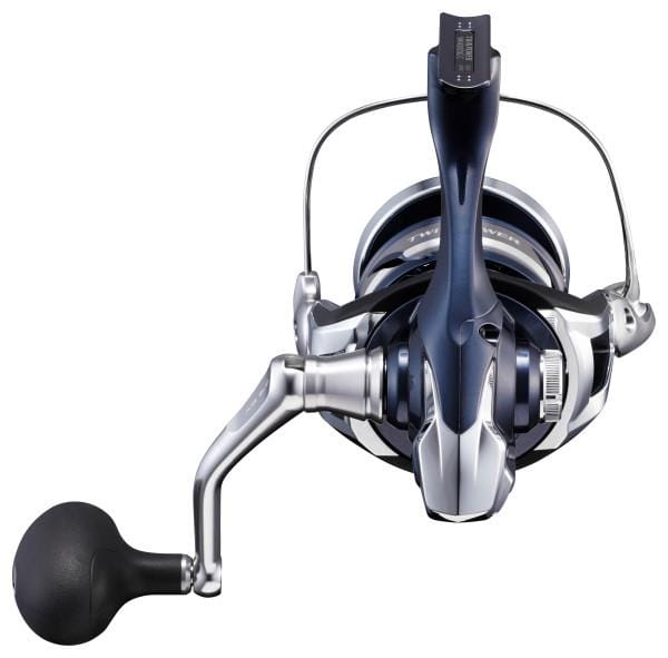 Shimano Twin Power SW spinning reel in black with silver accents, designed for saltwater fishing, shown from a side view.