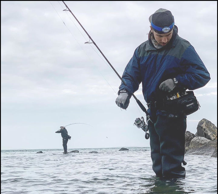 Glacier Outdoor Elite Angler gloves with textured grip, waterproof design, and insulated material for fishing in cold weather.
