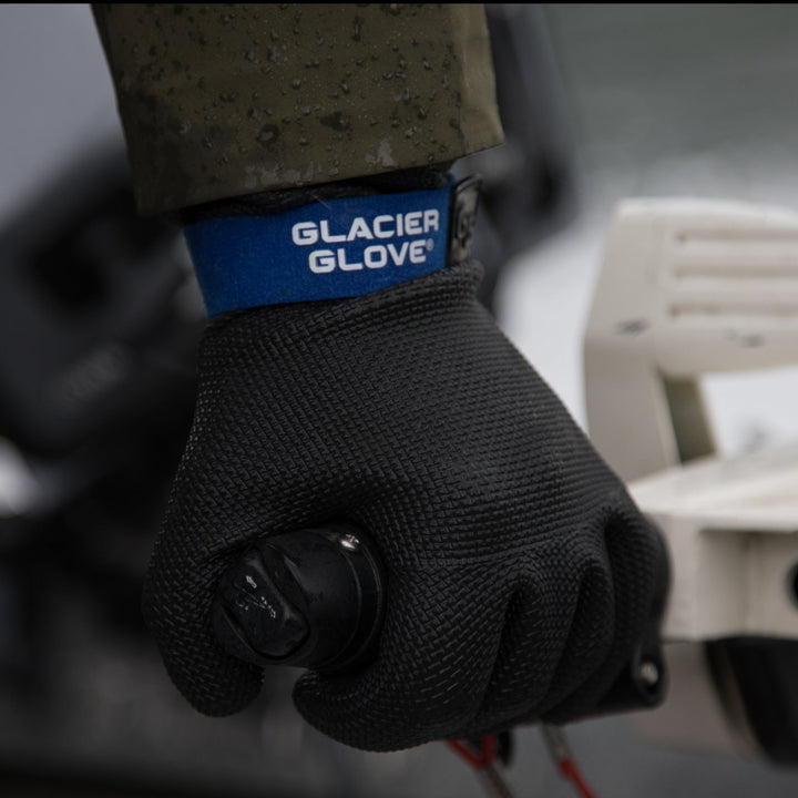 Glacier Outdoor Kenai™ Waterproof gloves in black, designed for outdoor activities, with reinforced palms and adjustable wrist straps.