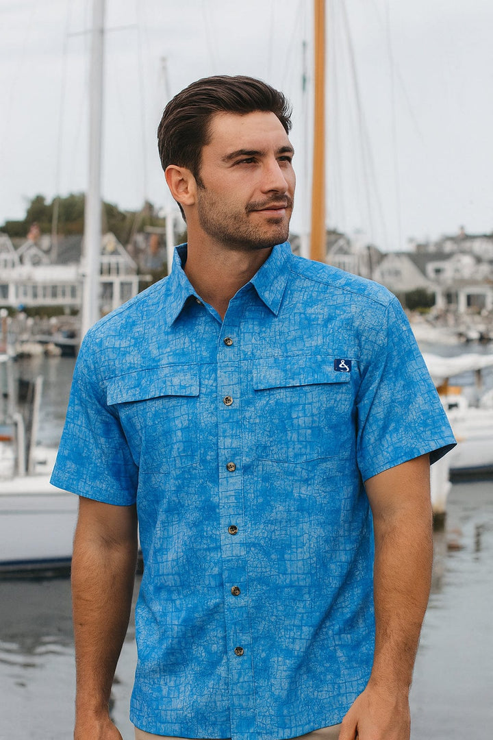 Men's blue Chaos UV Vented Fishing Shirt by Hook & Tackle, lightweight and breathable with vented design for outdoor fishing activities.