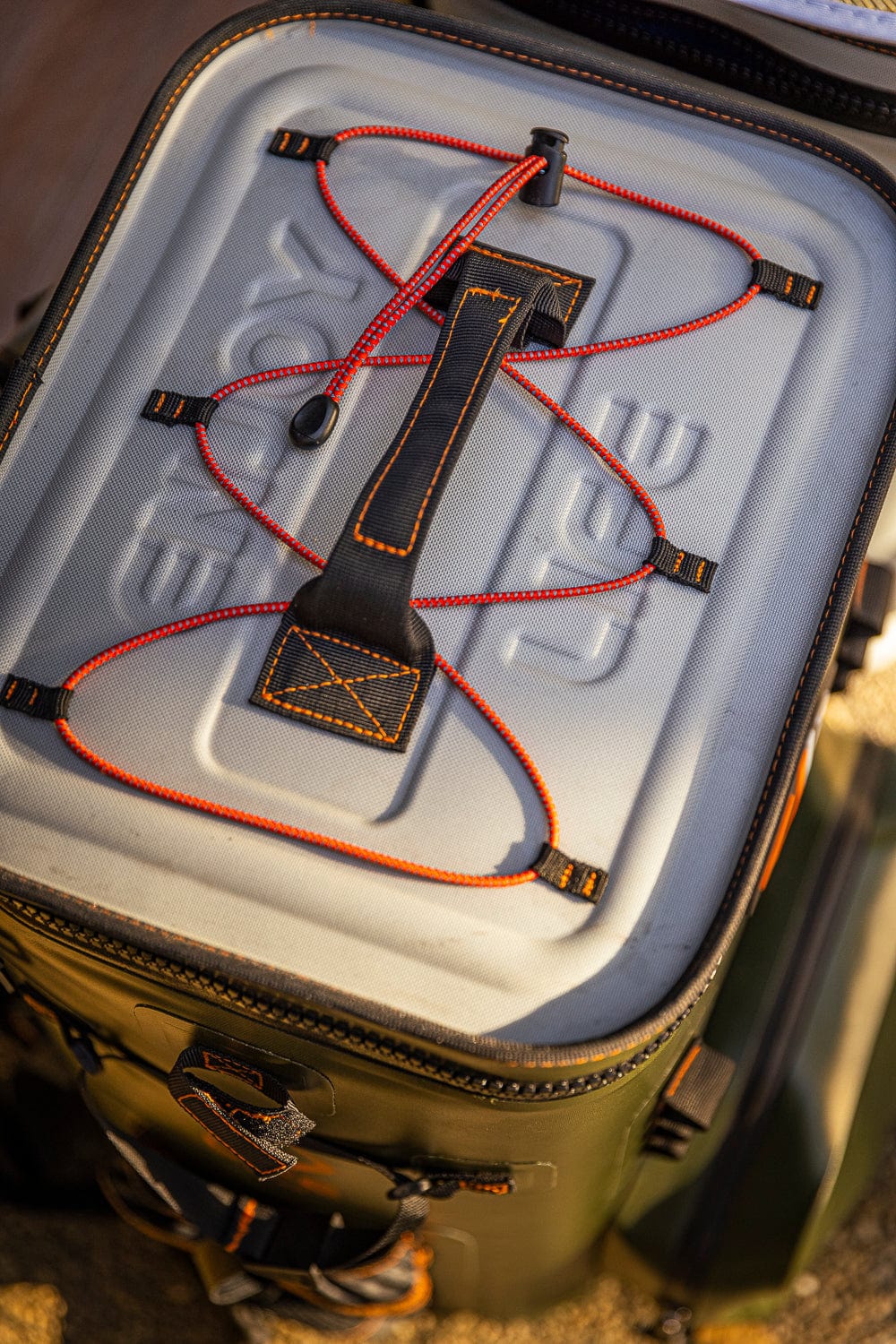 Large outdoor cooler backpack by Life League Gear with insulated compartments and adjustable straps for outdoor adventures.