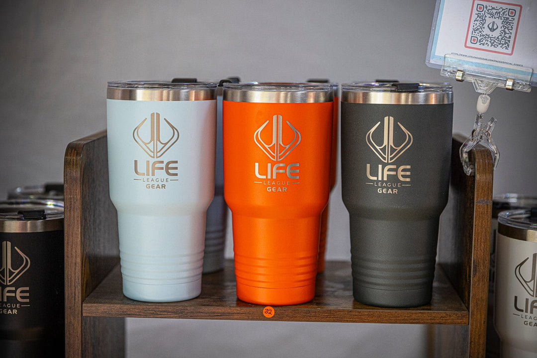 30oz. stainless steel tumbler with Life League Gear branding, featuring a sleek design and spill-proof lid.
