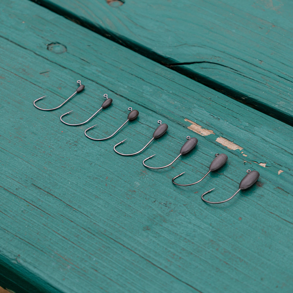 Reaction Tackle Tungsten Tube Jig Heads 5-Pack, lightweight fishing jig heads with durable tungsten material for angling.