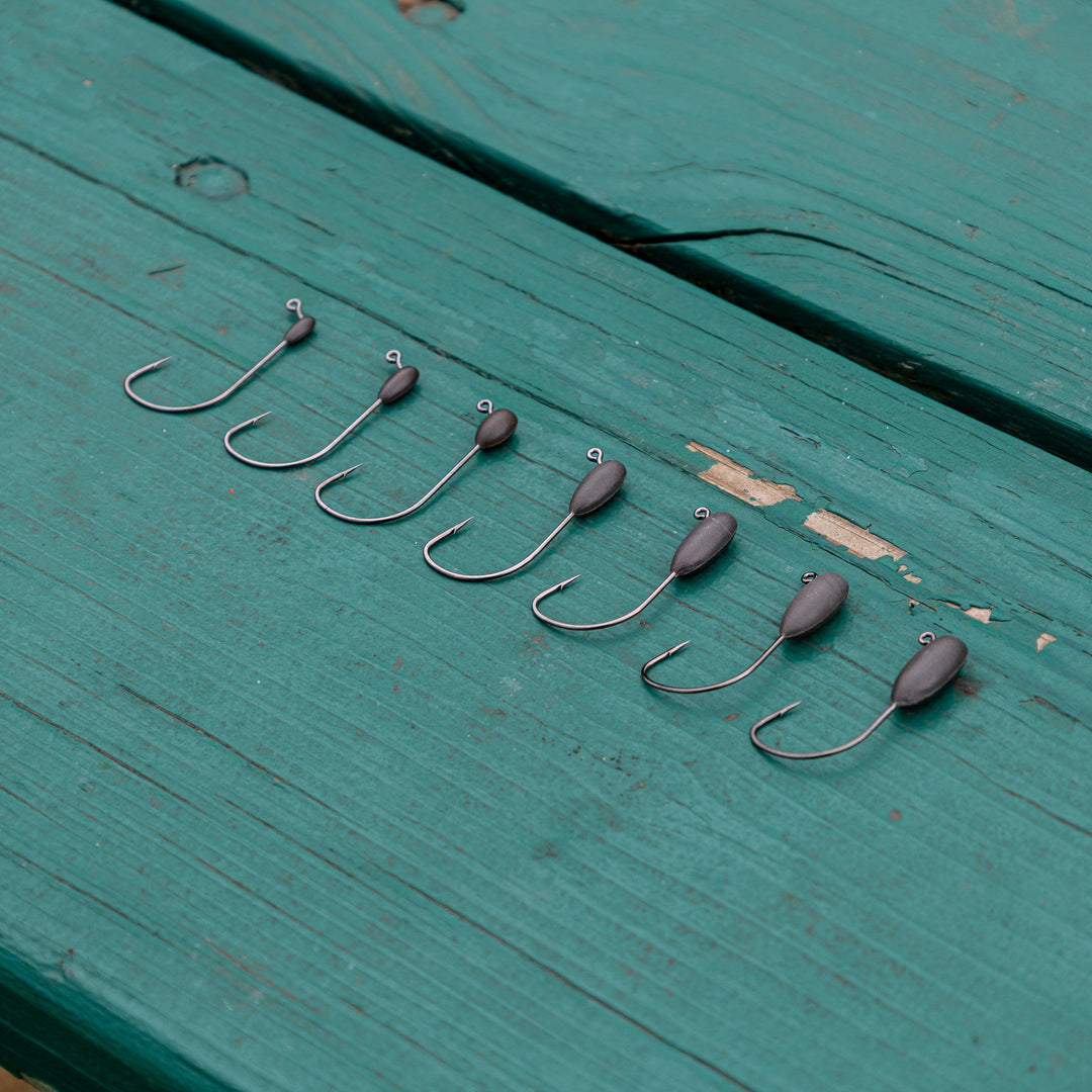 Reaction Tackle Tungsten Tube Jig Heads 5-Pack, lightweight fishing jig heads with durable tungsten material for angling.