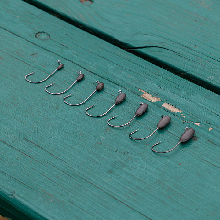 Reaction Tackle Tungsten Tube Jig Heads 5-Pack, lightweight fishing jig heads with durable tungsten material for angling.