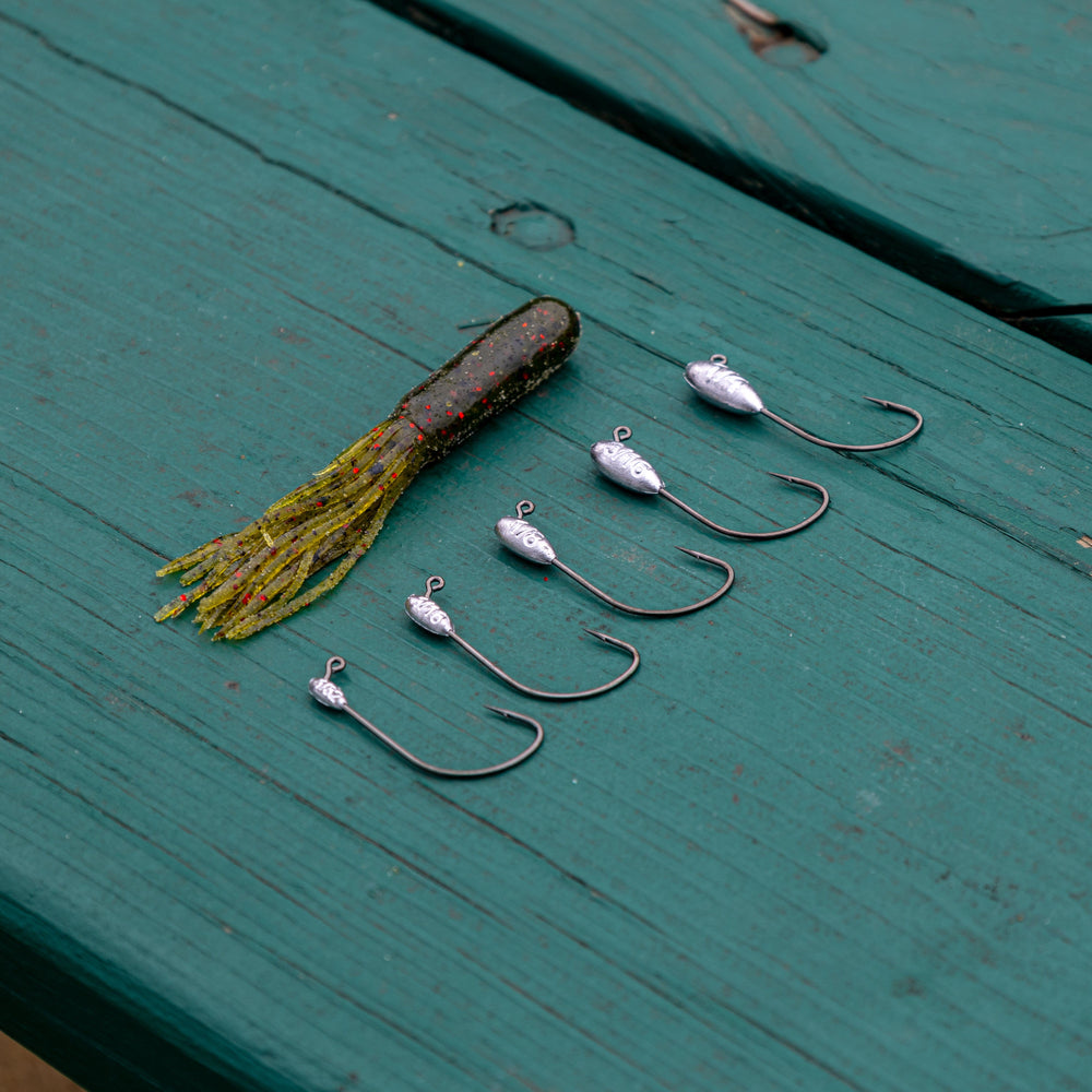 Reaction Tackle Lead Tube Jig Heads 10-pack, 1/8 oz, fishing tackle with durable hooks and sleek design for angling.