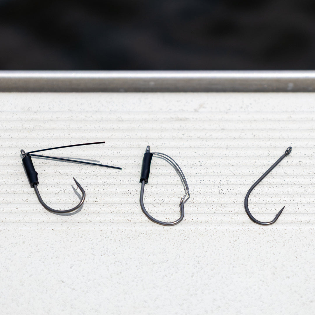 Reaction Tackle Wacky Neko Hooks, 25-pack, showing sharp fishing hooks designed for finesse fishing, arranged in a row.