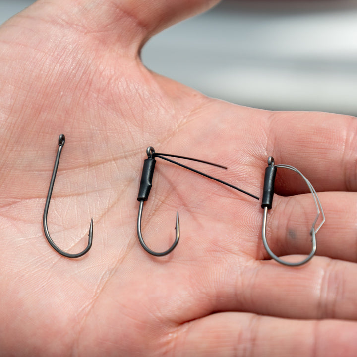 Reaction Tackle Wacky Neko Hooks 25-pack, sharp fishing hooks designed for finesse fishing, displayed on a plain background.