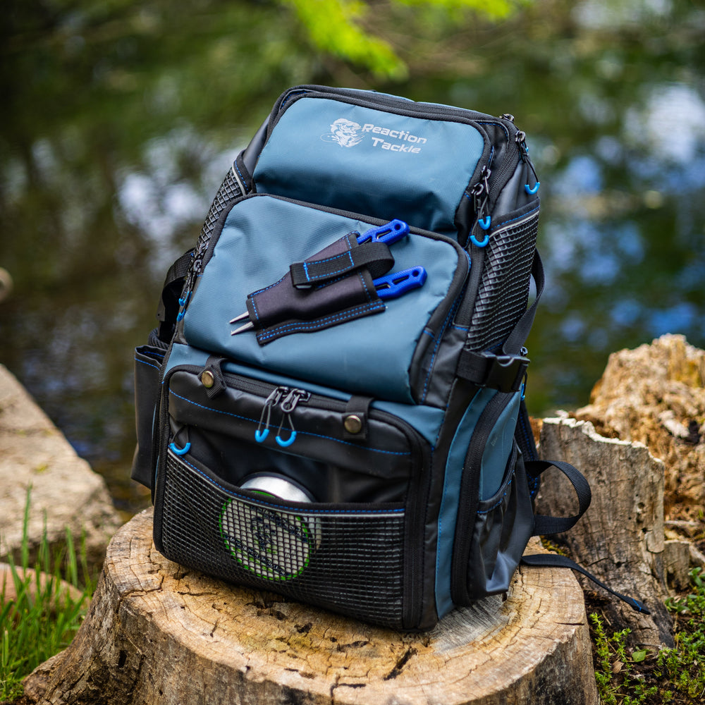 Reaction Tackle fishing backpack, a durable outdoor bag with multiple compartments for fishing gear storage.
