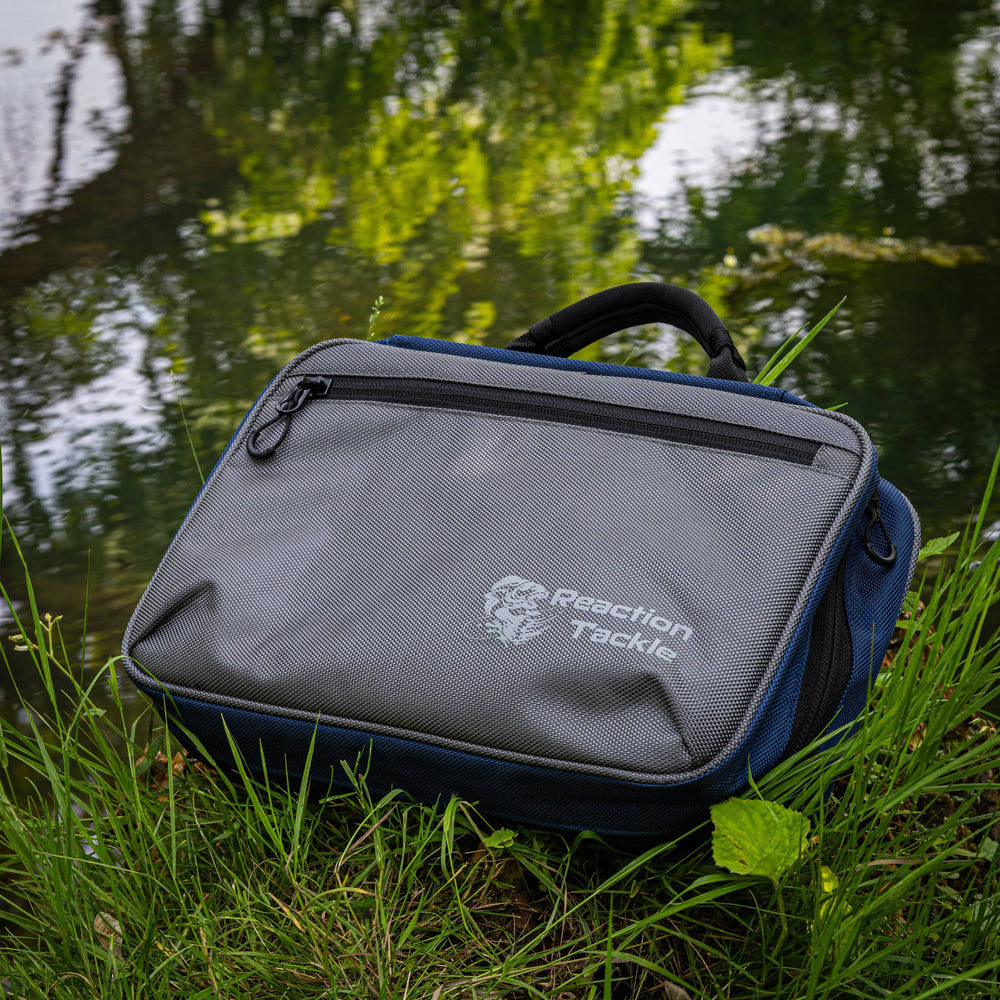 Reaction Tackle Deluxe Bait Binder and Tackle Storage bag with multiple compartments for fishing gear organization.