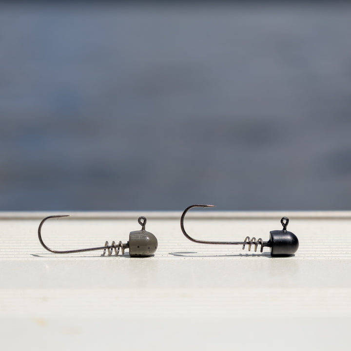 Reaction Tackle Tungsten Screw Lock Jig Heads 5-Pack, featuring durable hooks and sleek design for fishing enthusiasts.