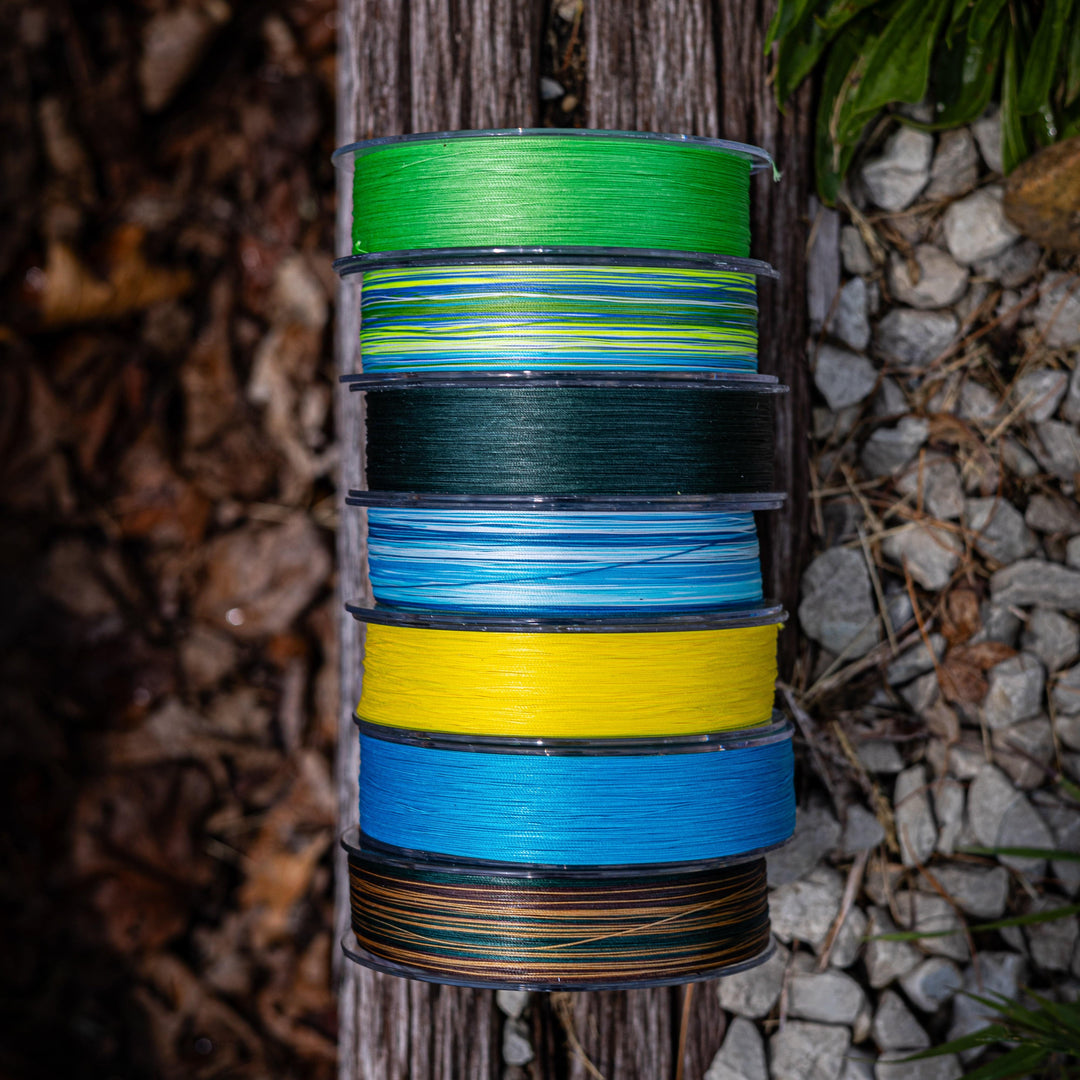 Reaction Tackle X8 Braided Fishing Line in blue camo, 8-strand, 10lb test, 150 yards, showing the textured braided fishing line.