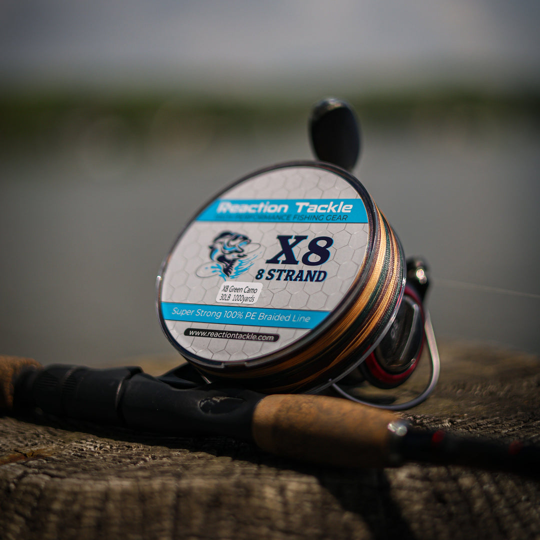Reaction Tackle X8 Braided Fishing Line in green camo, 8-strand, 10lb, 150 yards, showing the camouflage pattern and braided texture.