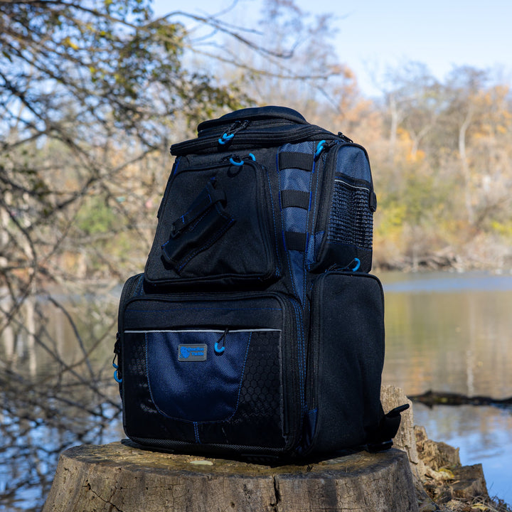 Reaction Tackle fishing tackle backpack with multiple compartments and trays for organized storage of fishing gear.