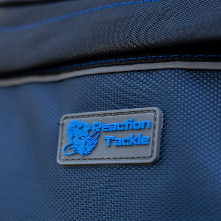 Reaction Tackle fishing tackle backpack with built-in trays, featuring multiple compartments for organizing fishing gear and accessories.