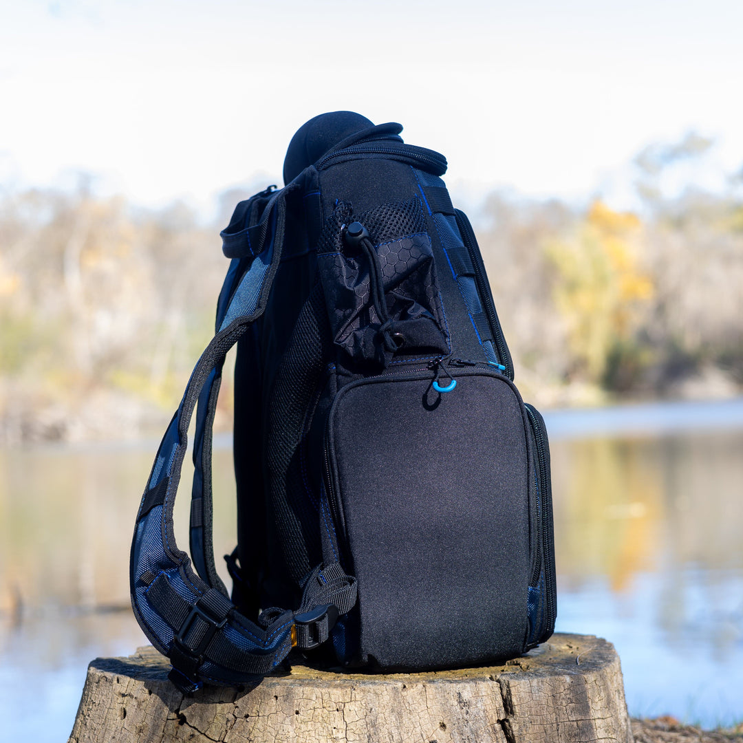 Reaction Tackle fishing tackle backpack with trays included, showing multiple compartments and sturdy straps for outdoor fishing trips.