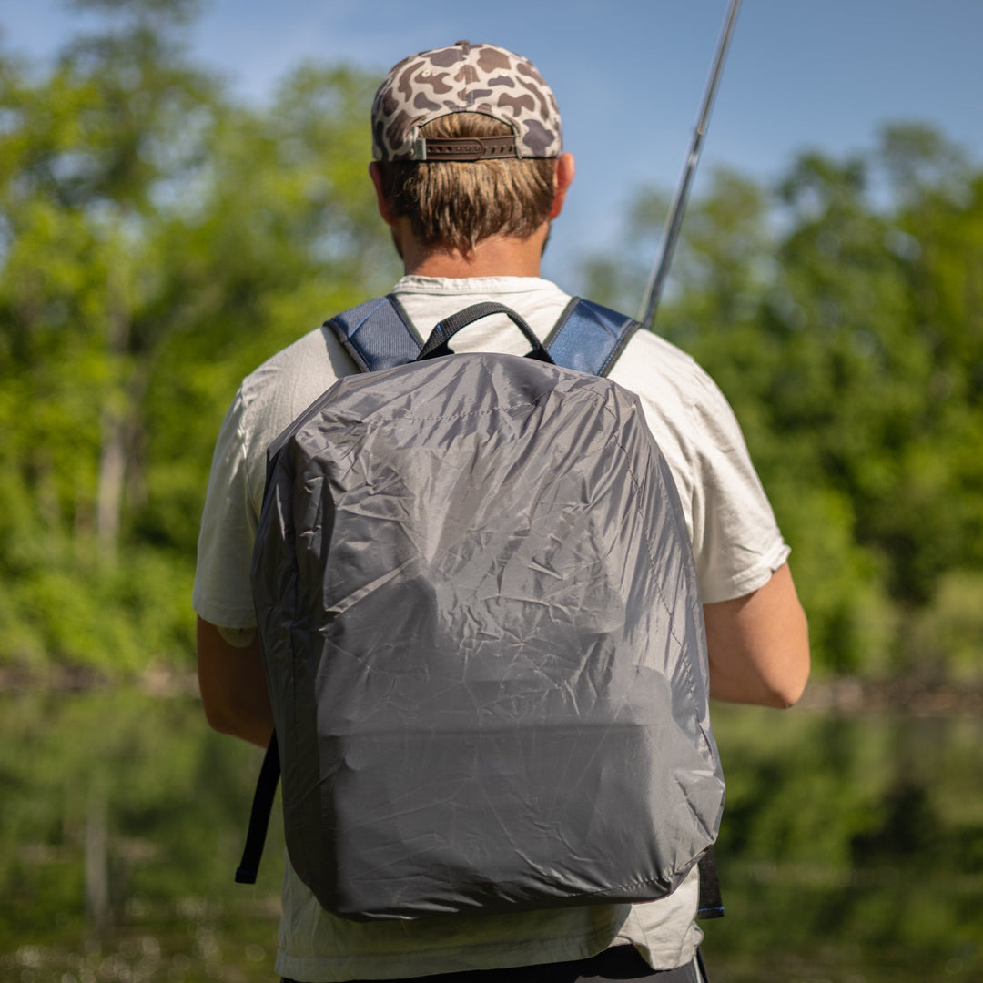 Reaction Tackle fishing tackle backpack with multiple storage trays, designed for organized fishing gear and equipment.