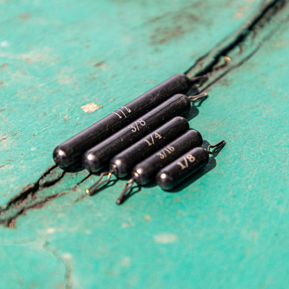 Reaction Tackle Tungsten Drop Shot Weights in black, skinny 1/8 oz, set of 8, designed for precise fishing drop shot techniques.