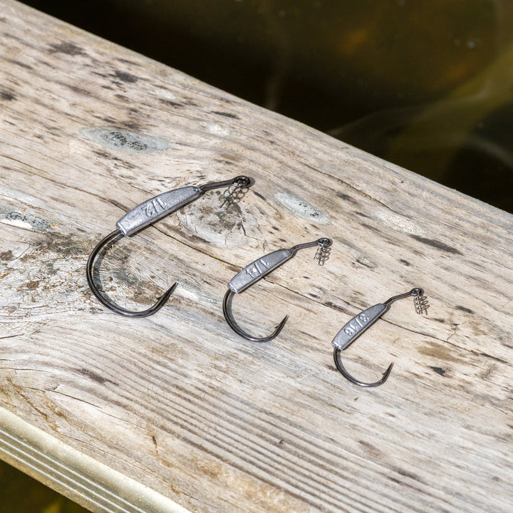 Reaction Tackle lead-weighted swimbait hooks, 10-pack, fishing hooks with 1/8 oz weight and 3/0 size for bass fishing.