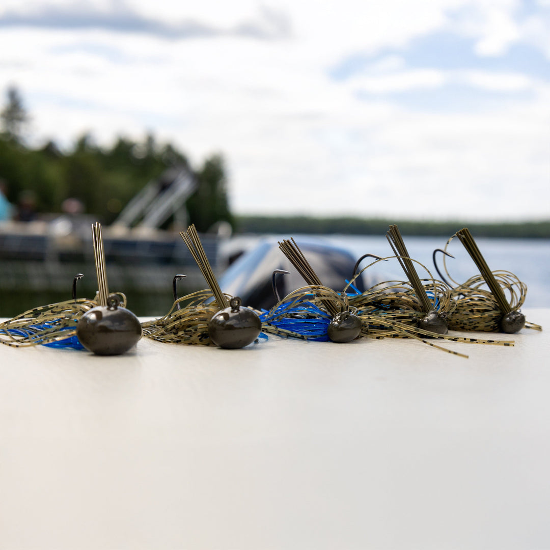 Reaction Tackle Tungsten Football Jigs 2-Pack, black fishing jigs ideal for bass fishing, 1/4 oz weight.