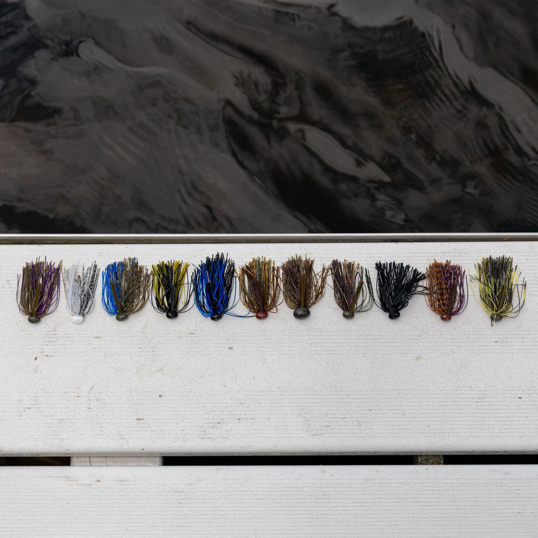 Reaction Tackle Tungsten Football Jigs in black, 1/4 oz, 2-pack, ideal for fishing with durable tungsten construction