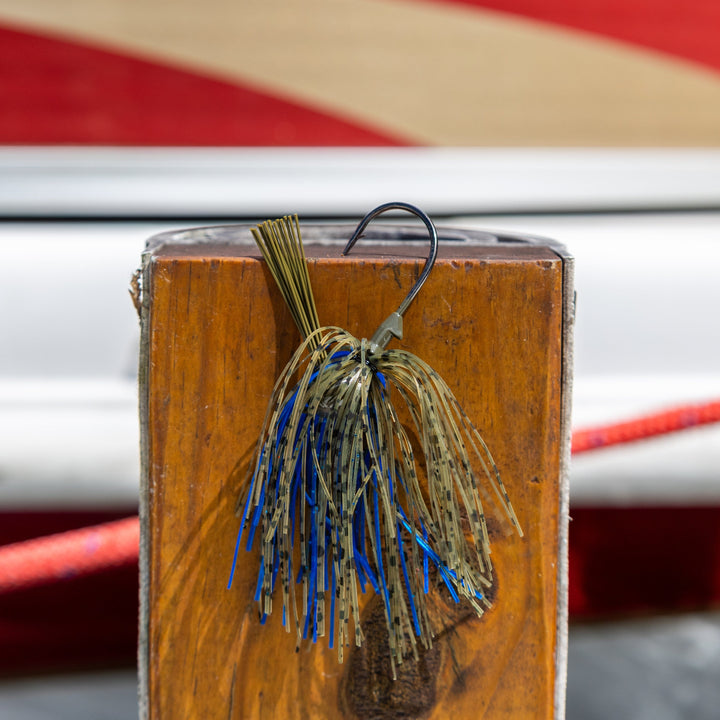 Two Reaction Tackle Tungsten Flipping Jigs for fishing, showing detailed hooks and sleek black design on a white background.