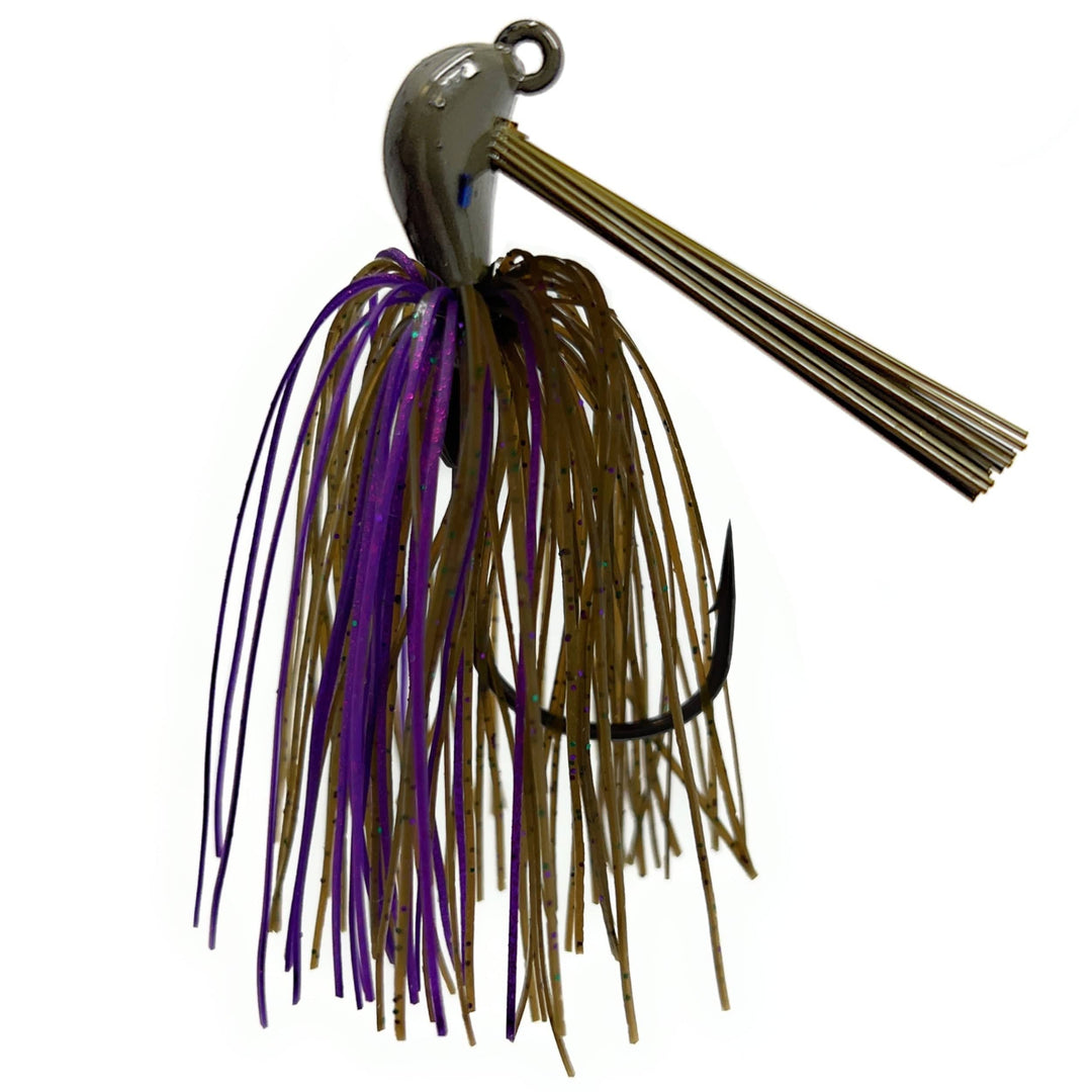 Two Reaction Tackle Tungsten Flipping Jigs for fishing, showcasing their compact design and sharp hooks in a natural setting.