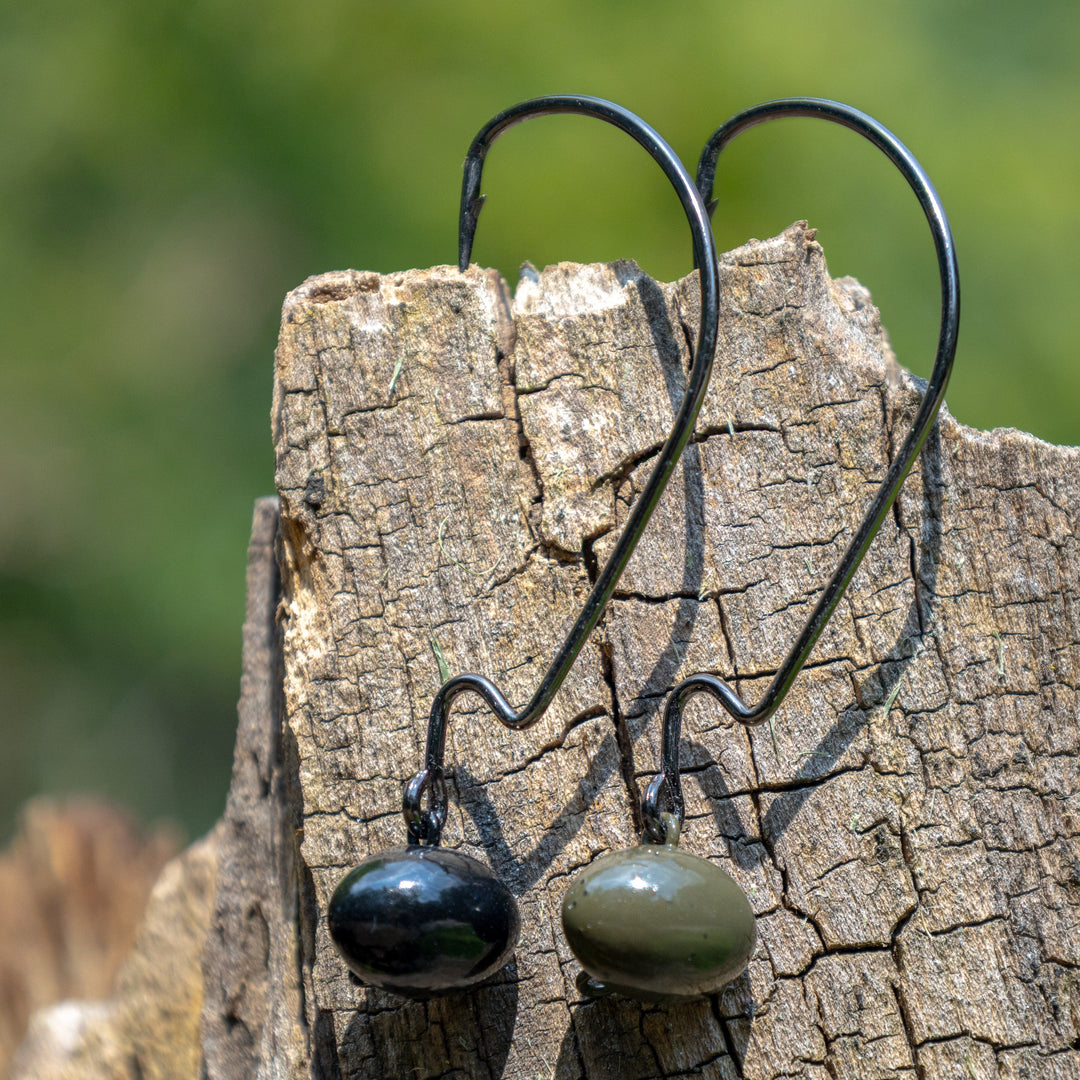 Reaction Tackle Tungsten Football and Swing Jig Heads 3-pack for fishing, shown with shiny tungsten finish and hook details.