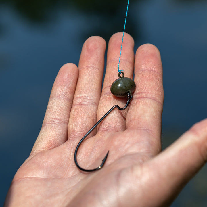 Reaction Tackle Tungsten Football and Swing Jig Heads in a 3-pack, featuring durable metal construction for fishing tackle.