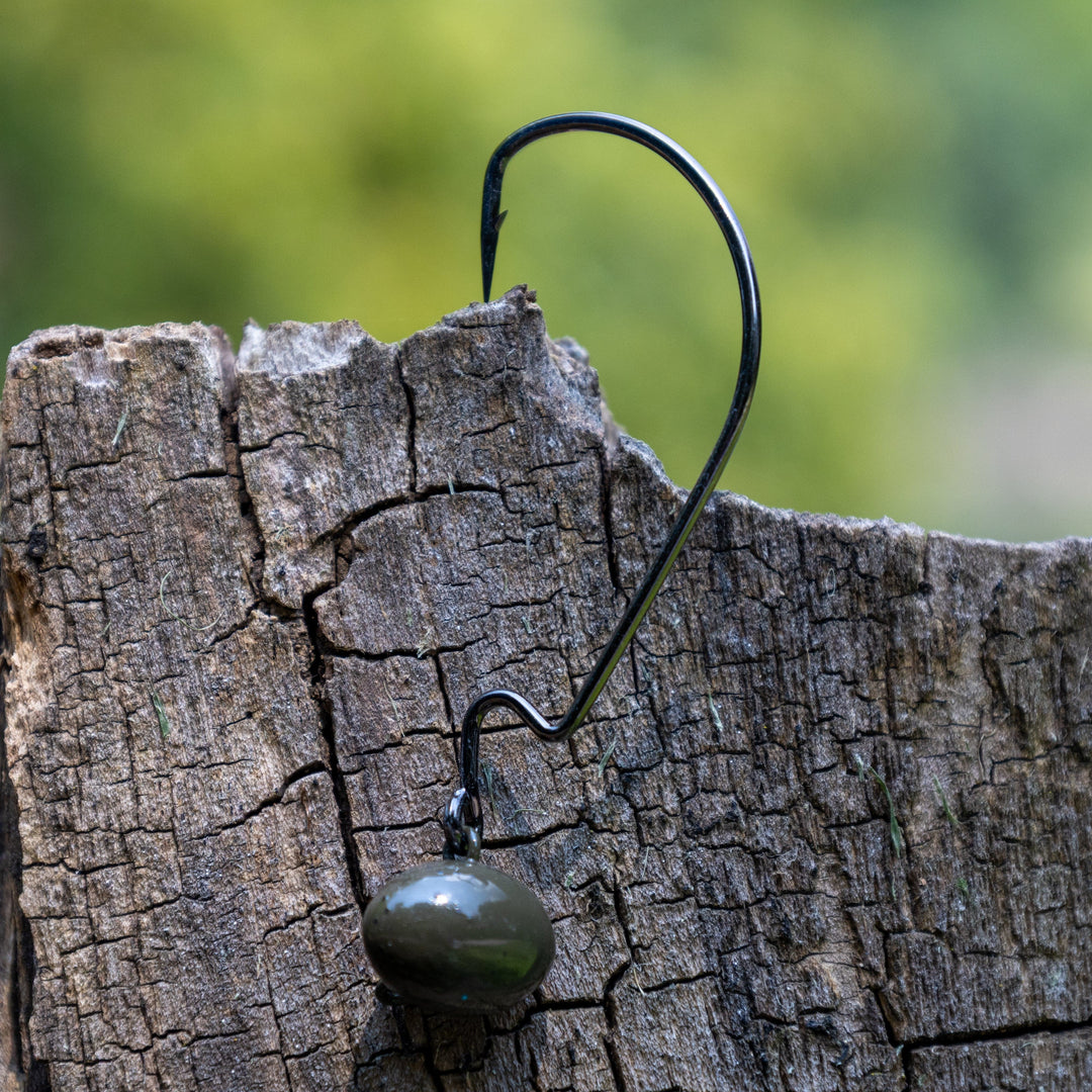 Reaction Tackle Tungsten Football and Swing Jig Heads, 3-pack, showing close-up of durable fishing jig heads with detailed hooks.
