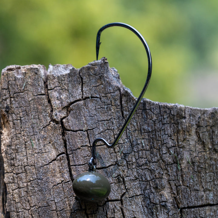 Reaction Tackle Tungsten Football and Swing Jig Heads, 3-pack, showing close-up of durable fishing jig heads with detailed hooks.